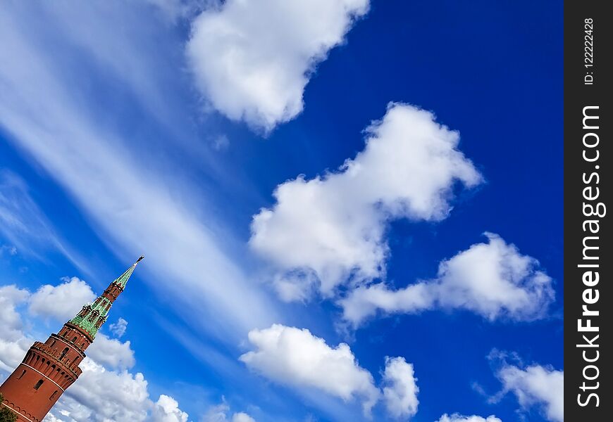 Blue Sky Background With Moscow Kremlin Tower In Left Corner