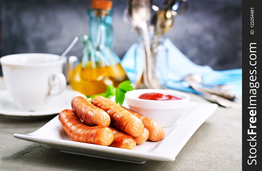 Fried sausages, sausages on white plate, stock photo