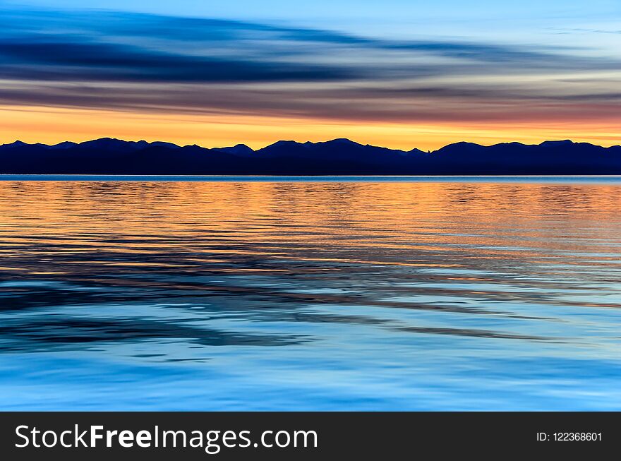 Beautiful Sunset Above The Sea And Mountain