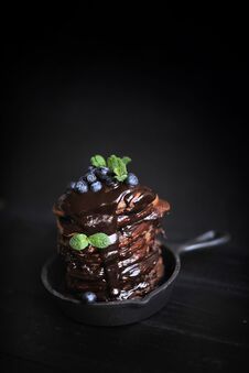 Chocolate Pancakes For Breakfast With Blueberries, Dark Photo. Homemade Baking. Royalty Free Stock Image