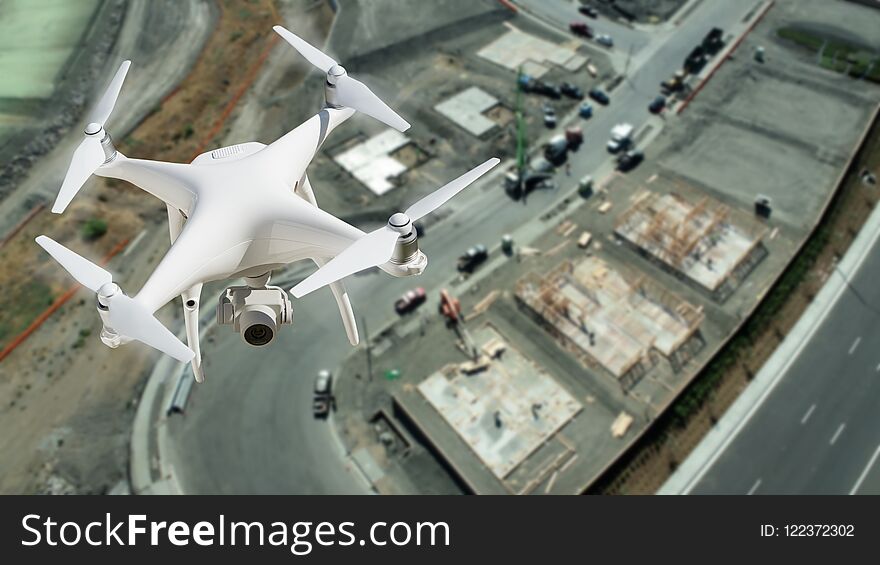 Unmanned Aircraft System UAV Quadcopter Drone In The Air Over Construction Site. Unmanned Aircraft System UAV Quadcopter Drone In The Air Over Construction Site.