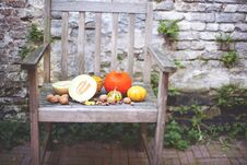 Autumn Nature. Fall Fruit On Wood. Thanksgiving. Autumn Vegetables On An Old Chair In The Garden, Free Space For Text Stock Photos Autumn Nature. Fall Fruit On Wood. Thanksgiving. Autumn Vegetables On An Old Chair In The Garden, Free Space For Text Stock Photos