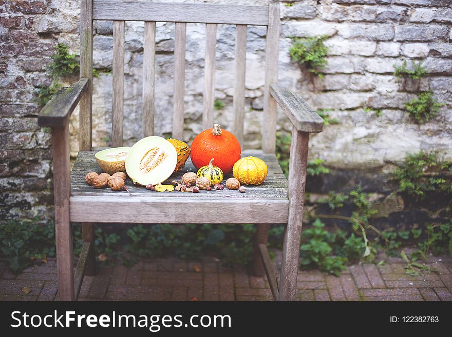 Autumn nature. Fall fruit on wood. Thanksgiving. autumn vegetables on an old chair in the garden, free space for text,