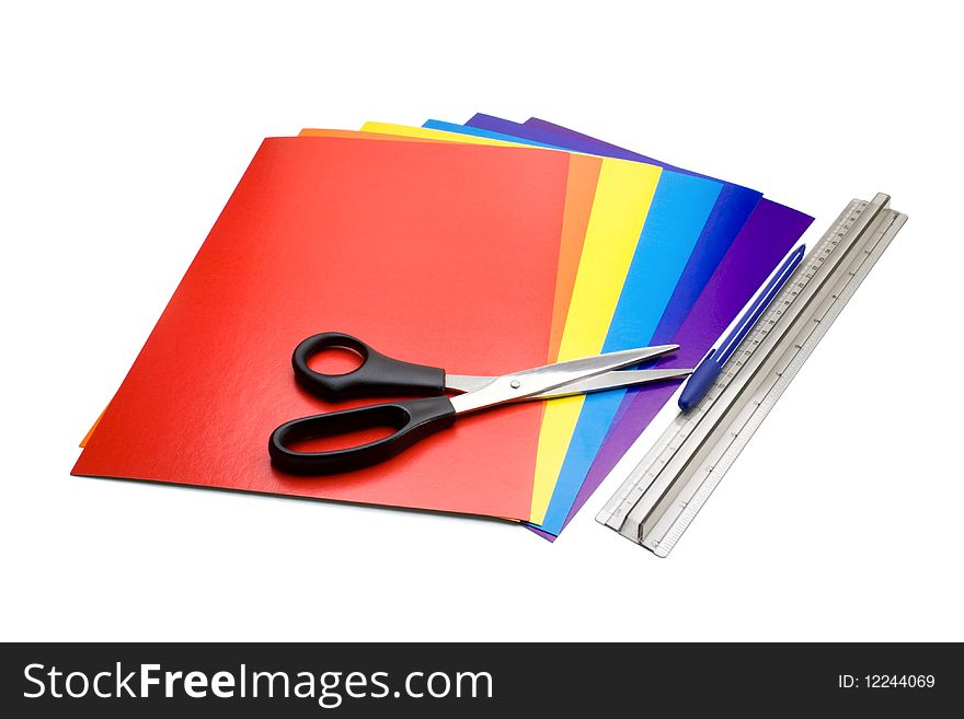 Colored paper, scissors, ballpen, ruler. All item isolated on white. Colored paper, scissors, ballpen, ruler. All item isolated on white.