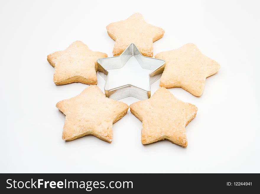 Homemade five biscuits and metal star shape. Homemade five biscuits and metal star shape