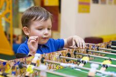 Little Boy Playing Board Football. Little Kid Playing In The Children Room Stock Image Little Boy Playing Board Football. Little Kid Playing In The Children Room Stock Image