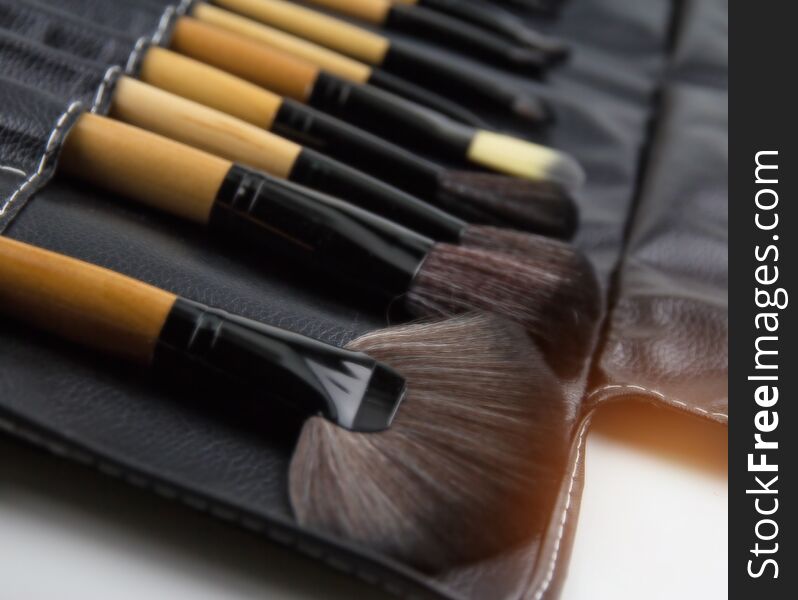 The Blurry Light Design Background Of  Cosmetic Brush Set Put In Black Leather Case,for Make Up,professional Brush Set,the Variati