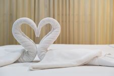 Close-up Folded Swans Bird Of Fresh White Bath Towels On The Bed Stock Image