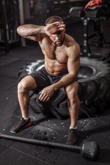 Fit Strong Man Feels Tired. Royalty Free Stock Photos Fit Strong Man Feels Tired. Royalty Free Stock Photos