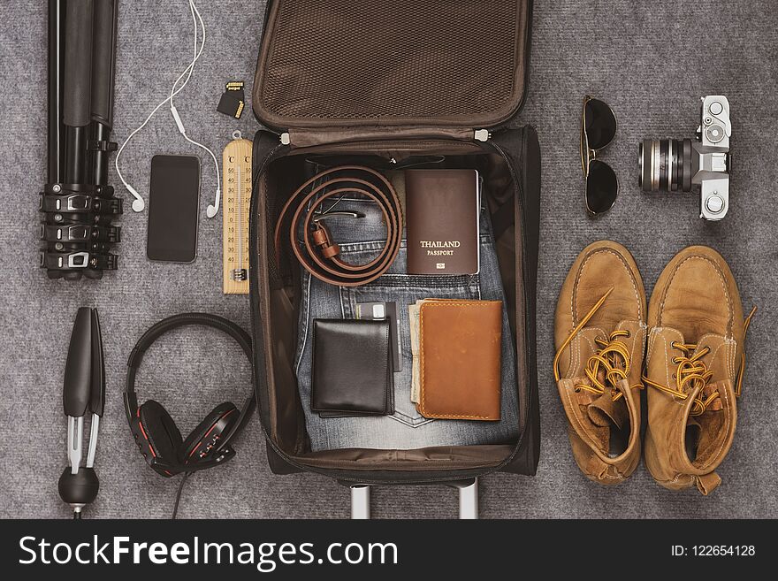Prepare luggage for holiday travel such as packs, money, glasses, cameras, phones, headphones
