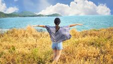 Young Woman Relaxing With Meadow, Sea, Mountain, Blue Sky And Cloud At Koh Sichang. Royalty Free Stock Images
