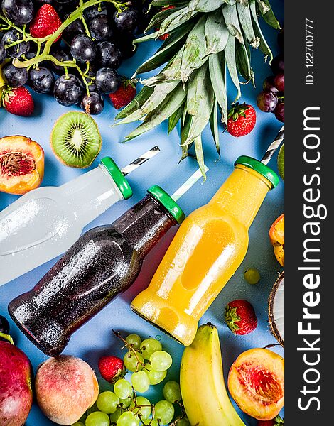 Different fruit juices smoothies concept, summer vitamins diet, with tropical fruits and berries on a light background,. Different fruit juices smoothies concept, summer vitamins diet, with tropical fruits and berries on a light background,