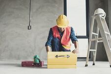 Worker Finding Tools In Construction Box In Working Site Royalty Free Stock Image