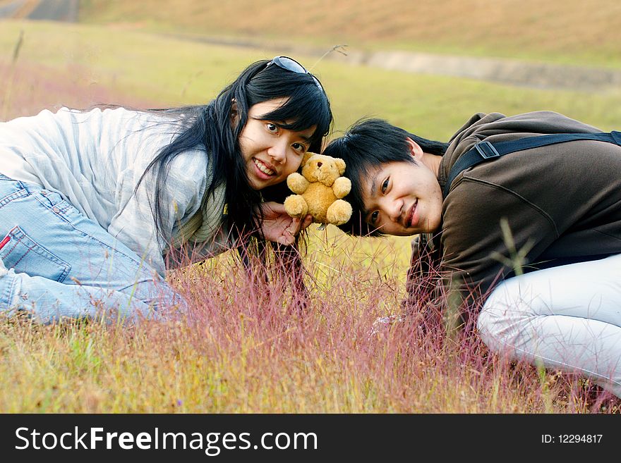 A couple having a great time in the fields.