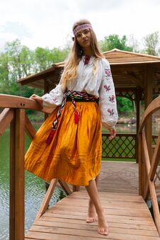 Steep Ukrainian Girl Resting In A Hot Dog On A Pond On A Hot Sun Stock Photography