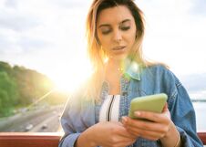 Girl Freelancer At Sunset Speaks On The Phone And Works Stock Photography Girl Freelancer At Sunset Speaks On The Phone And Works Stock Photography