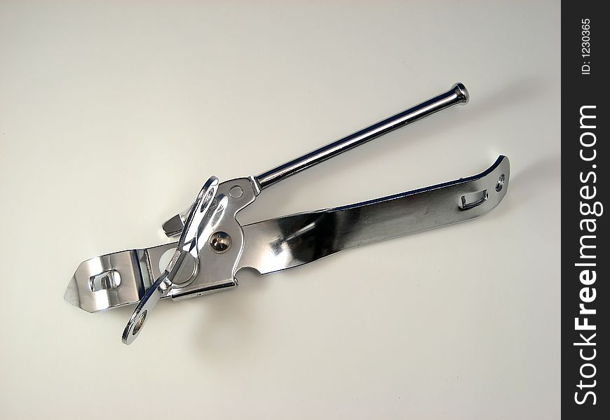 Metal Can Opener On A White Background