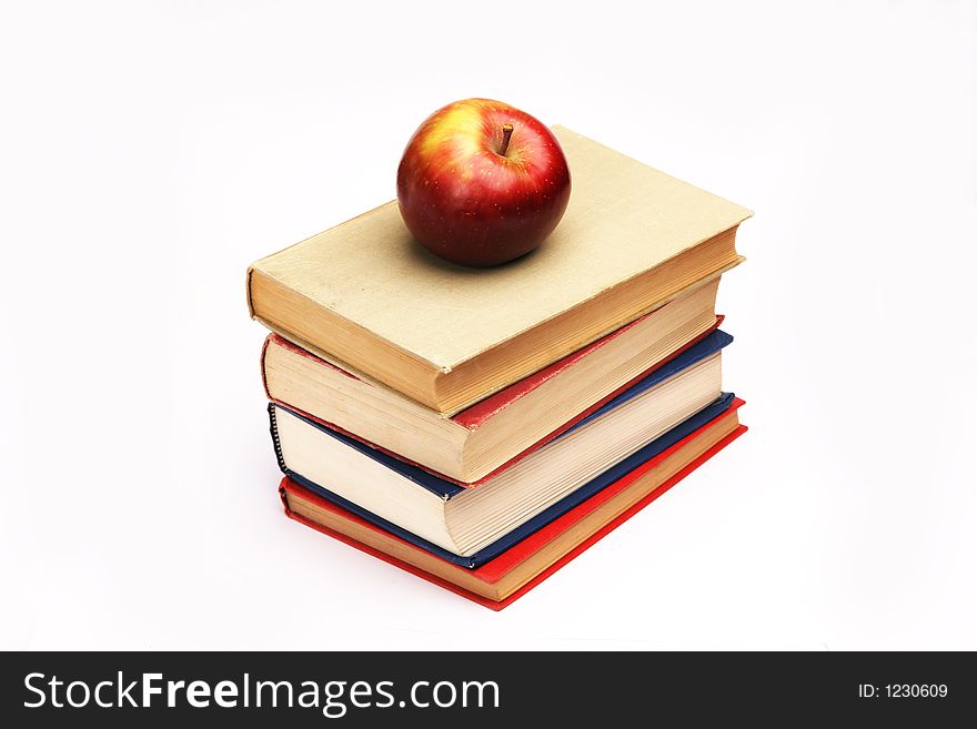 Pile of books with apple on top. Pile of books with apple on top