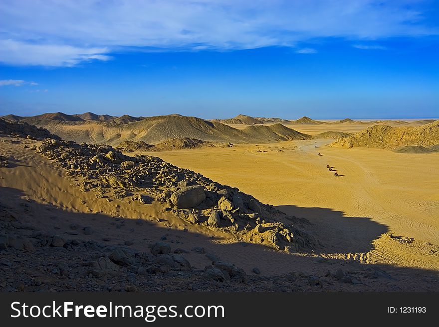 Desert, waves, golden sand and sky. Desert, waves, golden sand and sky.