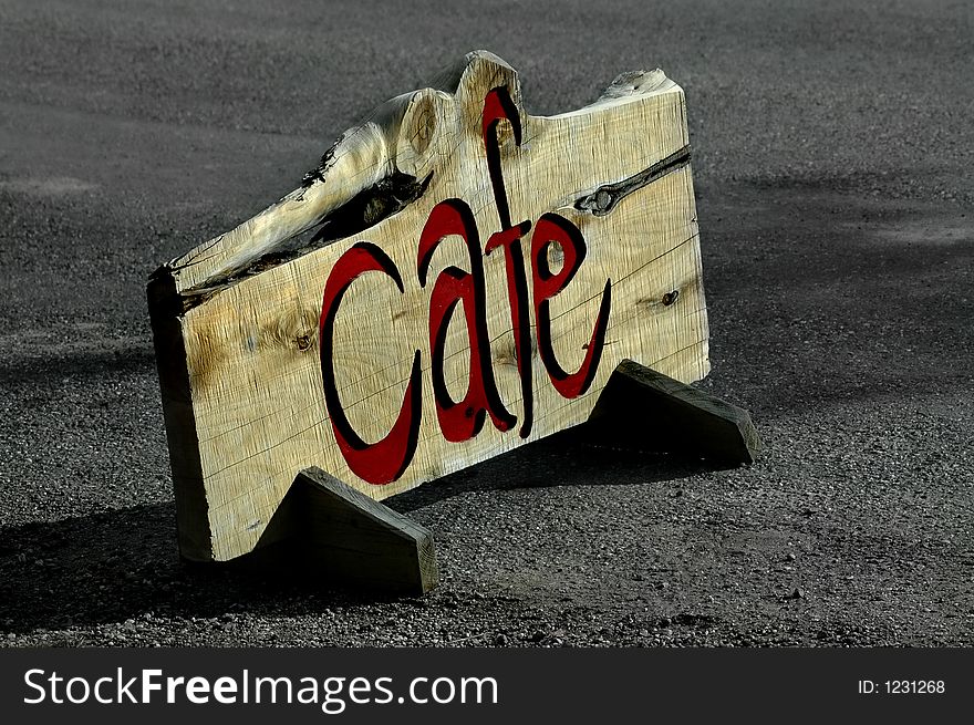 Road side wooden cafe sign