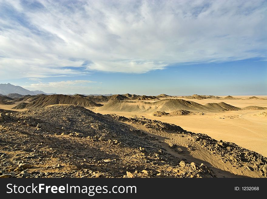 Desert, waves, golden sand and sky. Desert, waves, golden sand and sky.