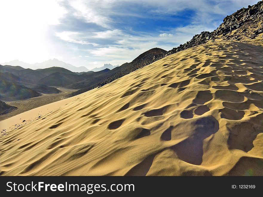 Desert, waves, golden sand and sky. Desert, waves, golden sand and sky.