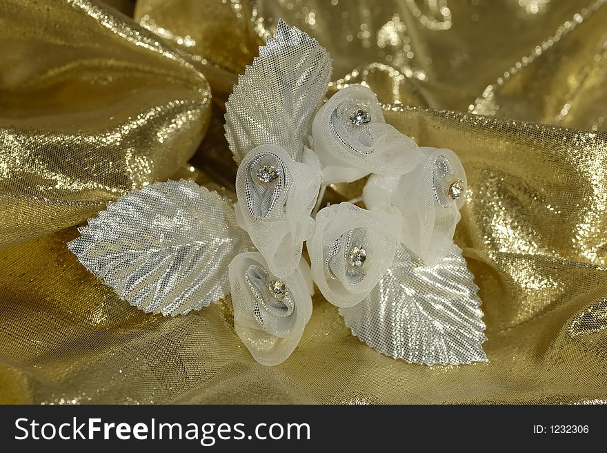 Photo of Fabric FLowers on a Gold Fabric. Photo of Fabric FLowers on a Gold Fabric