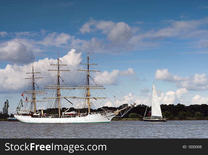 Three-masted ancient ship on parade on the river Scheldt during the 50th Tall Ships Race in Antwerp, 2006. Three-masted ancient ship on parade on the river Scheldt during the 50th Tall Ships Race in Antwerp, 2006