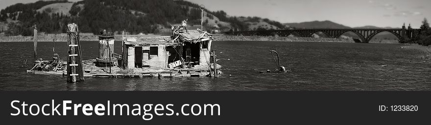 Panoramic black and whit image of defunct boat in scenic landscape. Panoramic black and whit image of defunct boat in scenic landscape.