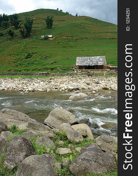 A shed on a hill with a river in front in Sapa, Vietnam. A shed on a hill with a river in front in Sapa, Vietnam