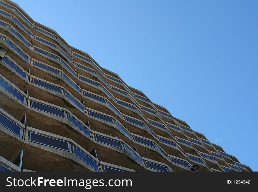 Detailed view of a flat or apartment at the seaside with a blue sky