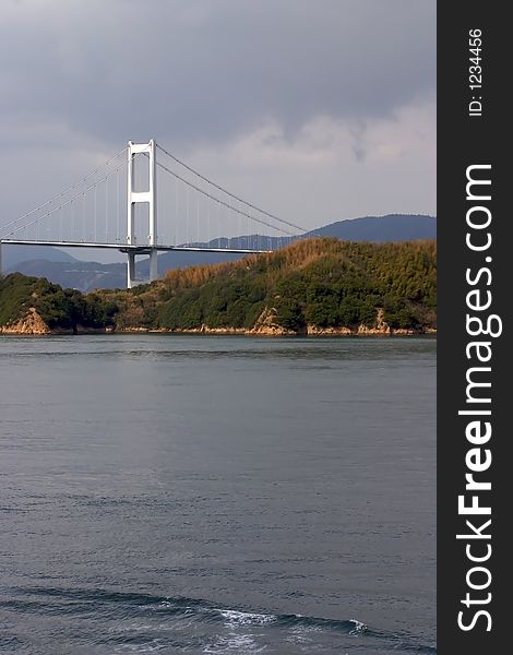 Japanese suspension bridge with island. Japanese suspension bridge with island