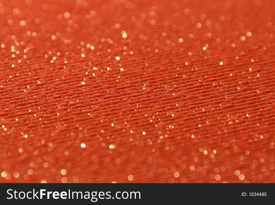 Water drops on a striped and textured orange bakground. Water drops on a striped and textured orange bakground
