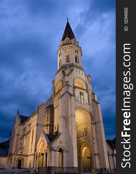 Basilica of the Visitation at night with stormy skies