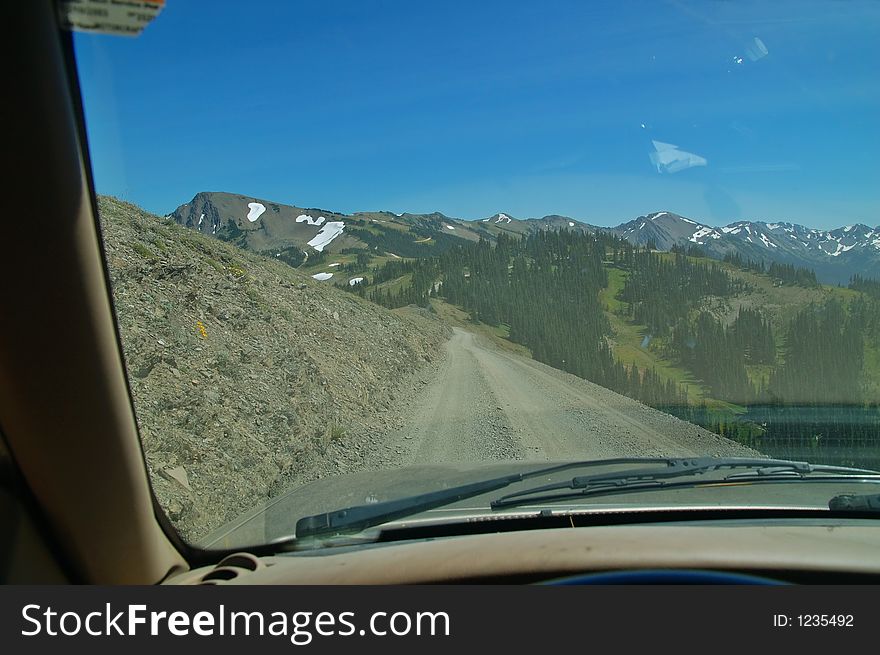 Dirt and gravel road high in the mountains of Olympic National Park in Washington State. Dirt and gravel road high in the mountains of Olympic National Park in Washington State