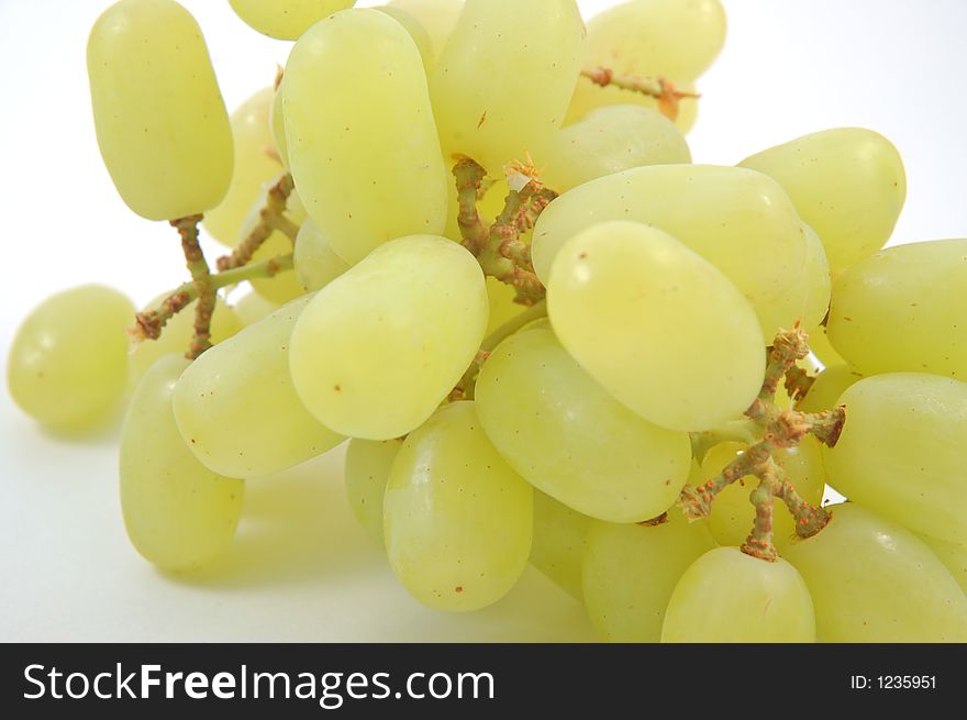 Green grapes with a white background