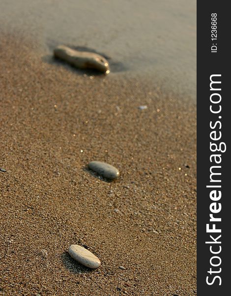 Rock trail on sand concept image