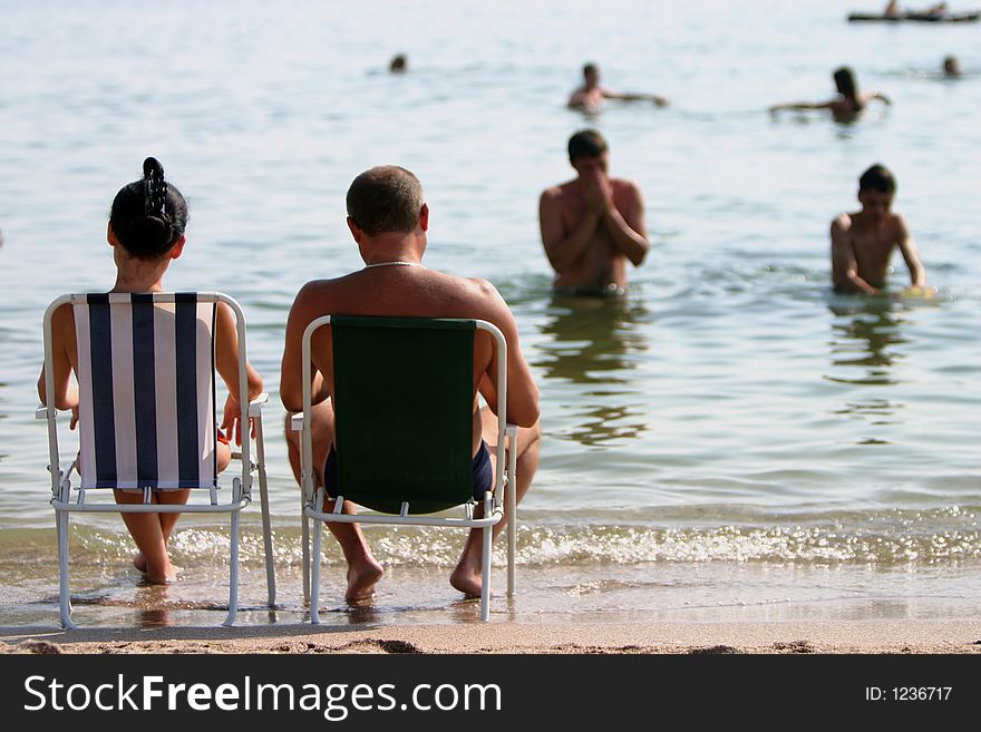 Couple in vacation relaxing on the wrm summer sun. Couple in vacation relaxing on the wrm summer sun