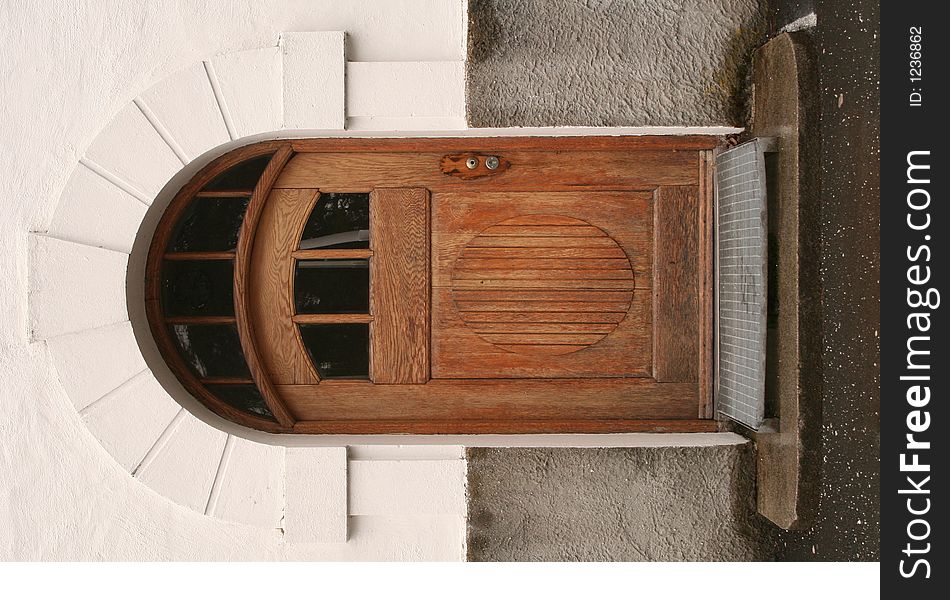An old brown wooden door. An old brown wooden door