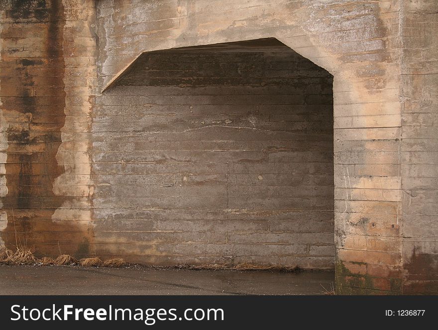A small tunnel for pedestrians under a bridge