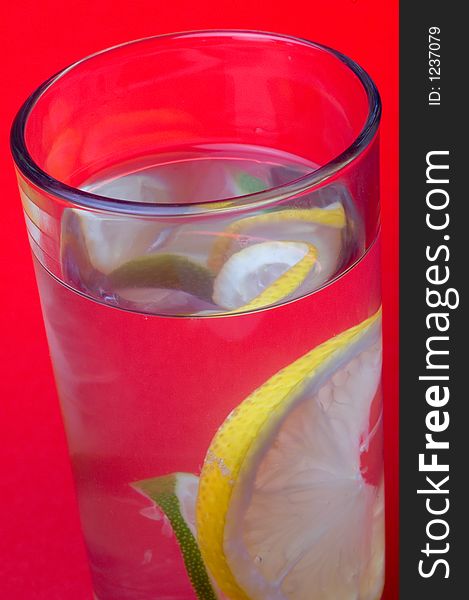 Close up of glass with drink and lemon. Close up of glass with drink and lemon