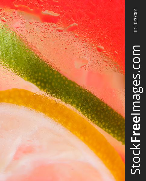 Close up of lemon and lime red background