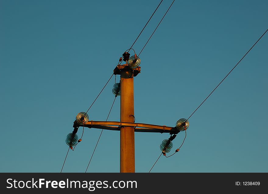 Power line and a blue sky in a background