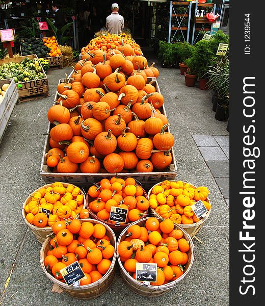 Baskets of orange pumpkins at the market