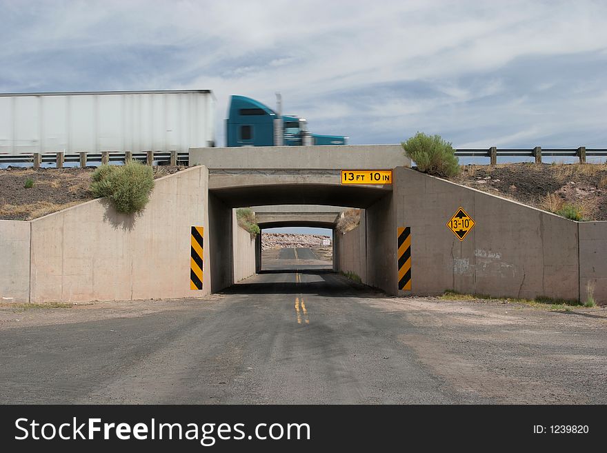 Truck crossing the bridge on a two lane road. Truck crossing the bridge on a two lane road