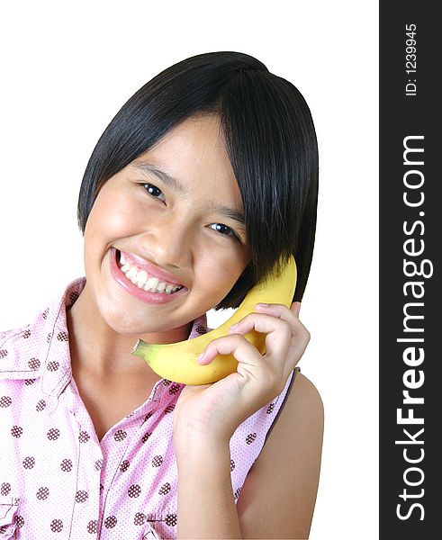 Pretty girl holding banana as a phone. Pretty girl holding banana as a phone.