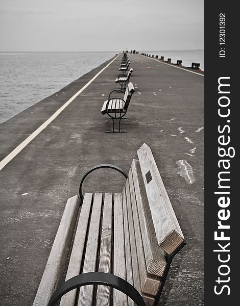 A row of benches on a pier