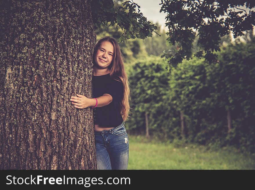 Young Girl Near Tree Posing