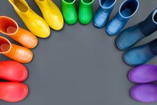 Colorful Rubber Boots-red, Orange, Yellow, Green, Cyan, Blue And Purple Stand In The Shape Of A Rainbow . Royalty Free Stock Image