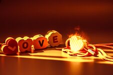 Love Is Fire Concept : The Word Love On The Wooden Floor Royalty Free Stock Image